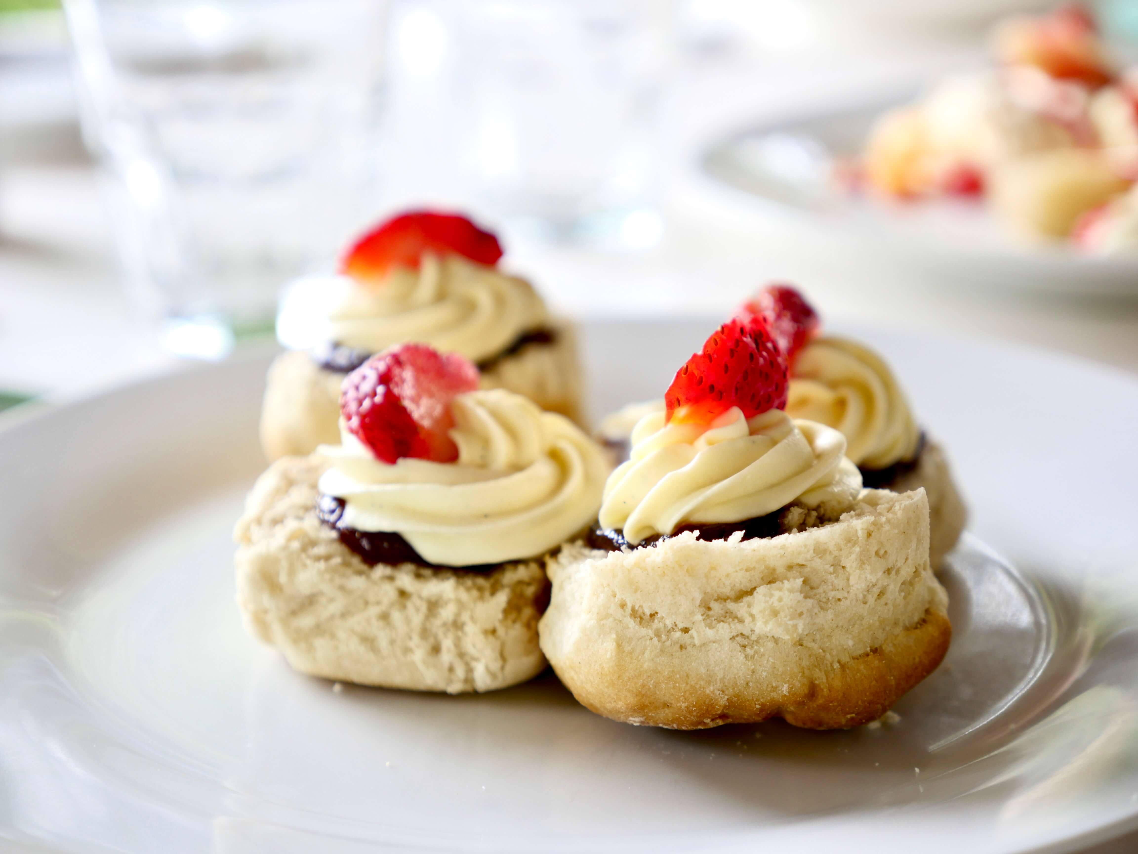 Flavoursome home made scones with cream and strawberry jam.